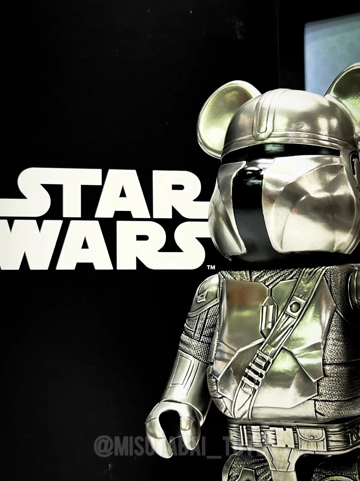 Polished pewter Bearbrick 400% figure depicting The Mandalorian from Star Wars, with engraved armor details.