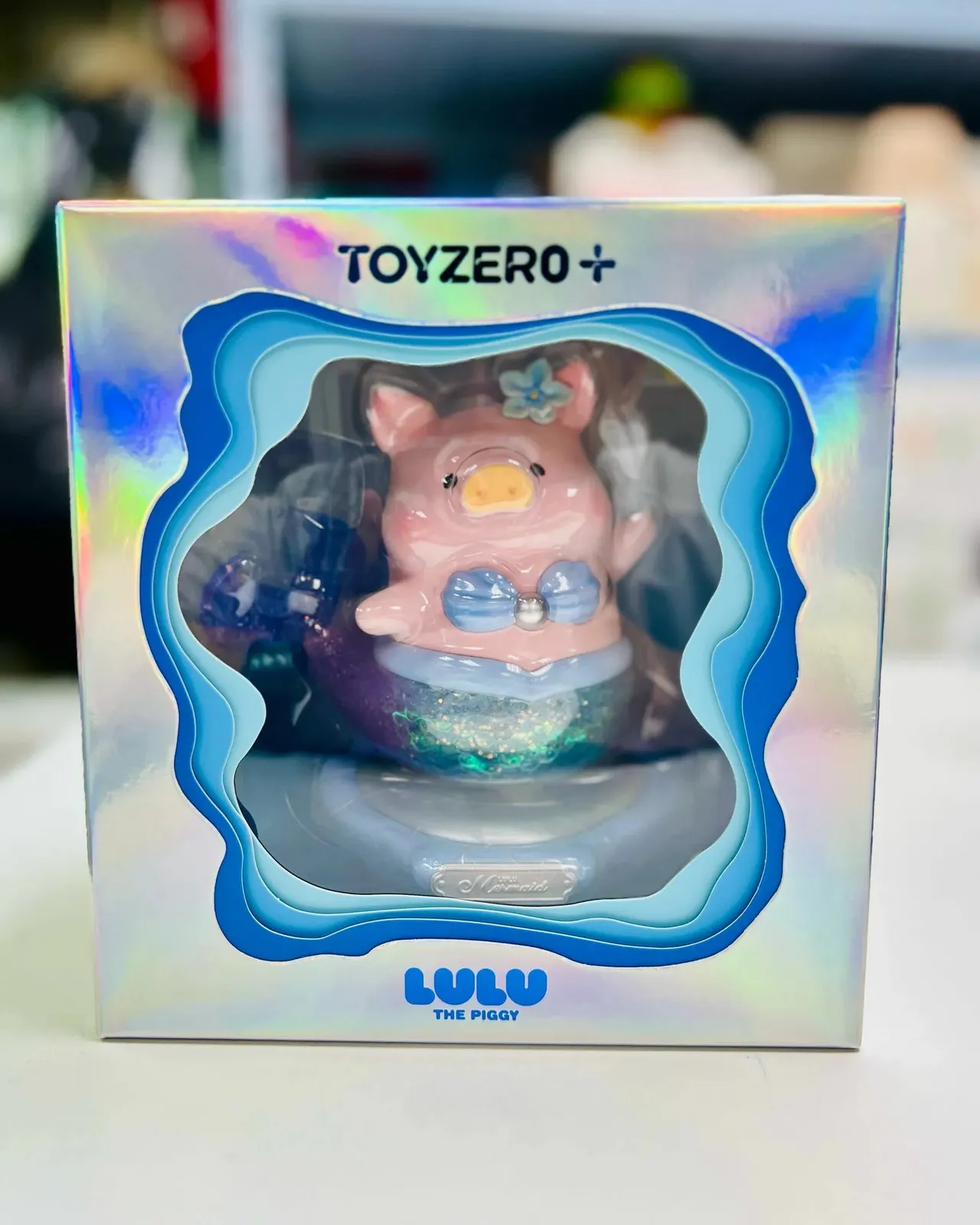LuLu the Piggy XL Mermaid figurine in azure color, depicting a small pig with a mermaid tail.