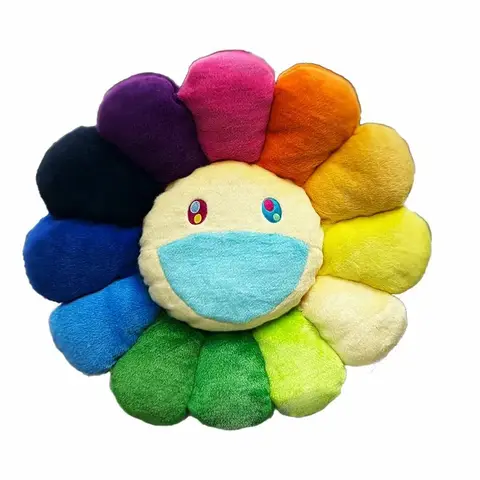 Gran cojín Takashi Murakami Flower Cushion de 200cm, con diseño de flor sonriente blanca y pétalos arcoíris.
